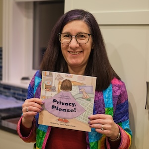 person holding Privacy,
 Please! book